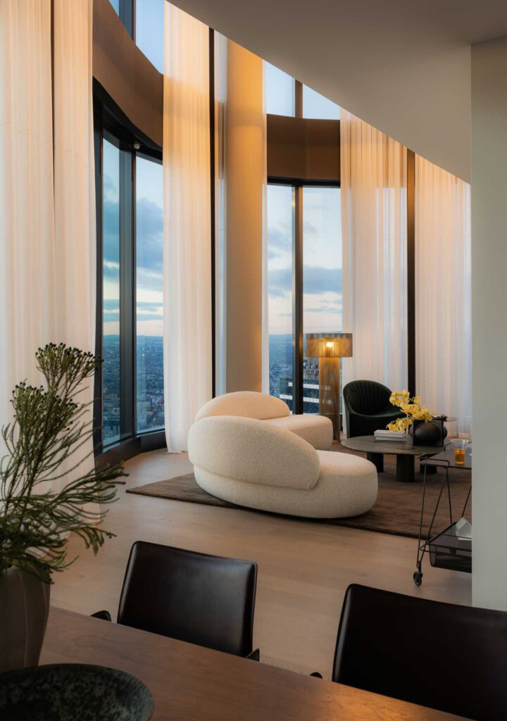 DOMO Penthouse living room Spin Sofa HC28 Oyster Armchair Asola Floor Lamp FURNISHD Cloud Residence Southbank Dylan James